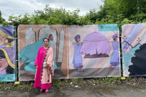 pmp lady stood infront of hoardings